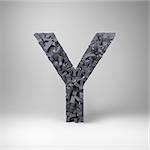 Letter Y made out of scrambled small letters in studio setting