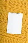 Note paper on Italian pasta background