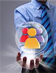 Power of social networking concept with glass sphere over businessman hand
