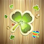 Saint Patrick's Day card with clover and wood background