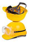 two yellow hard hats on white background