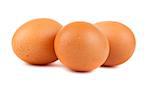 Three brown chicken eggs isolated on white background