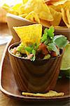 guakomole and corn chips - avocado and tomato dip