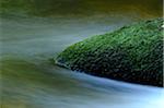 Detail of flowing waters of a little River in autumn in the bavarian forest, Bavaria, Germany.