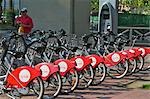 Parked Red Bikes for hire, Seville, Andalusia, Spain, Europe