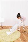 Girl Vacuuming a Carpet