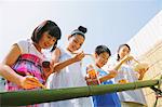 Children Enjoying the Flowing Somen