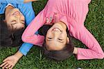 Girl And Boy Relaxing On the Grass