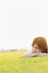 Woman Relaxing In Meadow