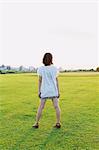 Woman Standing On Meadow