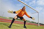 Woman In Goal Keeper Uniform Playing Soccer