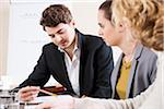 Young Business People at Meeting in Boardroom