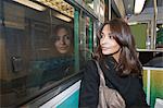 Smiling woman riding subway