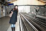 Woman waiting at train station