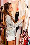 Woman shopping for clothes in store