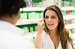 Woman talking to clerk in store