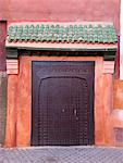 Ornate metal door on village street