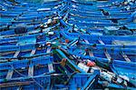 Blue boats docked in harbor