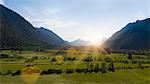 Sun shining over rural landscape