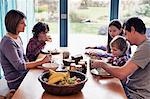 Family having dinner together at table