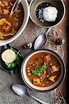 Bowl of stew with garlic and lemon