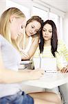 Teenage girls studying together