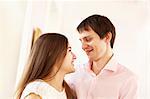 Couple smiling together indoors