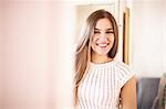 Smiling woman standing indoors