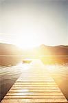 Wooden pier in still rural lake