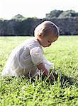 Girl playing in tall grass