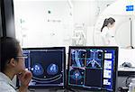 Nurse examining x-rays in hospital