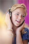 Smiling girl listening to headphones