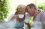 Couple having coffee together outdoors