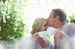 Couple having coffee together outdoors