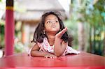 Girl laying on picnic table