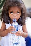 Girl drinking out of water bottle