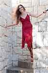 Woman climbing stone steps outdoors