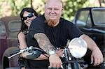 Couple sitting on motorcycle