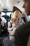 Businesswoman sitting in airplane