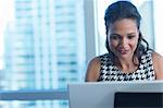 Businesswoman working on laptop