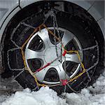 Close up of snow chains on car tire