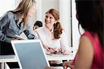 Businesswomen talking in office