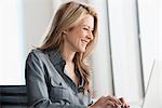 Businesswoman working on laptop