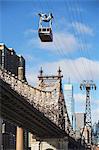 Chairlift over urban bridge