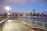 New York City skyline lit up at dusk