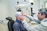 Doctor giving patient eye exam