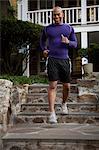 Man jogging on steps outdoors