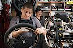 Mechanic working in bicycle shop