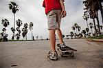 Boy riding on skateboard in park