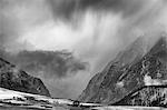 Clouds over snowy rural landscape